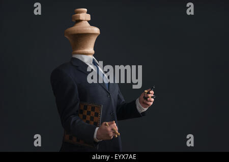 Symbol of a Headless Narcissist with pawns in the hands Stock Photo