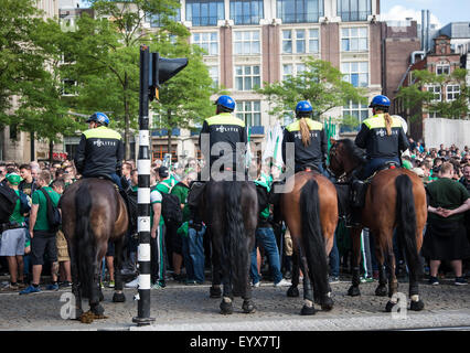 Amsterdam, Netherlands. 4th August, 2015. Amsterdam police controlling SK Rapid Wien football fans in Dam square in Netherlands Credit:  steven roe/Alamy Live News Stock Photo