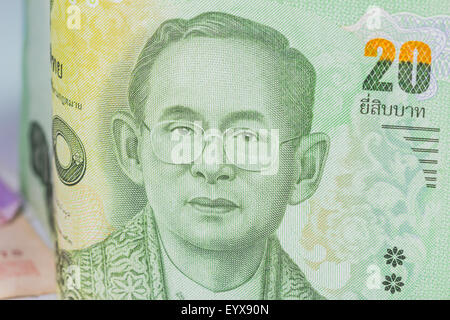 Close up of thailand currency, thai baht with the images of Thailand King. Denomination of 20 bahts. Stock Photo