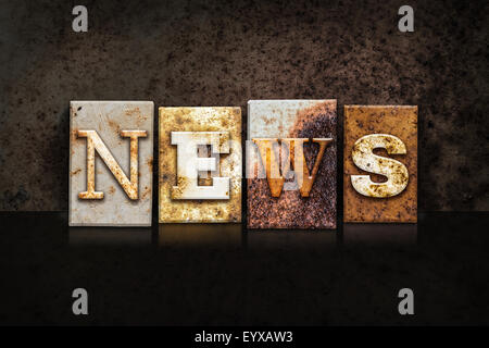 The word "NEWS" written in rusty metal letterpress type on a dark textured grunge background. Stock Photo