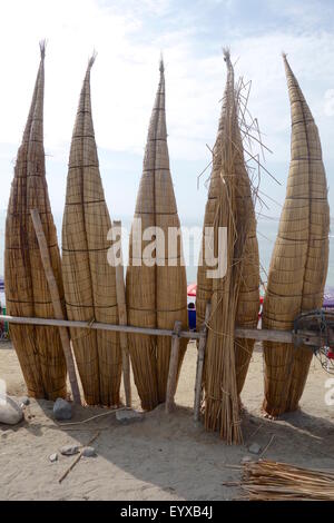 'Caballitos de Totora', traditional fishing boats made of reeds, on the beach in Huanchaco, Peru. Stock Photo