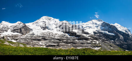 Panoramic view of Monch and Jungfrau from the Eiger walk just above Kleine Scheidegg Stock Photo