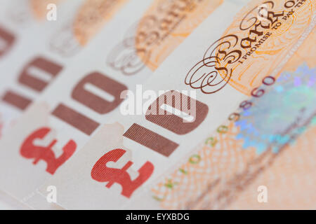 Background of ten UK pound bank notes (sterling) Stock Photo