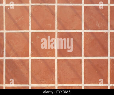 Terracotta floor square tile background texture in Mallorca, Balearic islands, Spain in July. Stock Photo