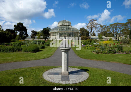 Sun dial and path to the The Palm House, National Botanic Gardens, Glasnevin, Dublin City, Ireland Stock Photo