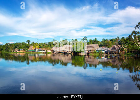 Town on the shore of the Yanayacu River in the Amazon rain forest near Iquitos, Peru Stock Photo