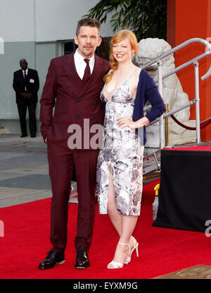 Actor Ethan Hawke and actress Sarah Snook pose at Hawke's hand-print