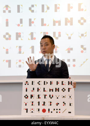 Tokyo, Japan. 5th Aug, 2015. Japanese designer Kenjiro Sano denies an alleged plagiarism during a news conference in Tokyo on Wednesday, August 5, 2015. Belgian designer Olivier Debie has claimed that the recently unveiled emblem Sano designed for the 2020 Tokyo Olympics resembles the logo Debie designed for a Belgian theater. Debie sent a letter to the International Olympic Committee and the Tokyo Olympics Organizing Committee seeking its retraction. Credit:  Natsuki Sakai/AFLO/Alamy Live News Stock Photo