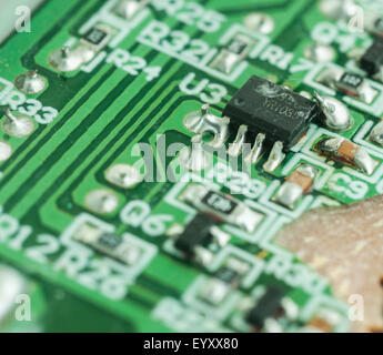 Closeup of an electronic printed broken circuit board with many electrical Stock Photo
