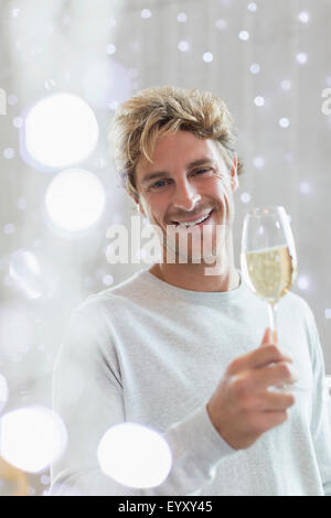 Portrait smiling man drinking white wine Stock Photo