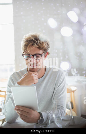 Man using digital tablet Stock Photo