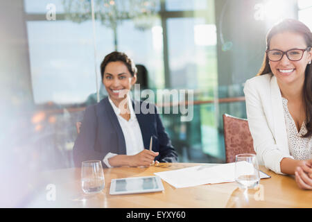 Portrait smiling businesswomen in conference room Stock Photo