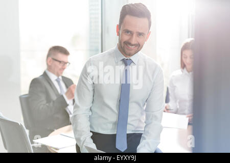 Portrait smiling businessman in conference room meeting Stock Photo
