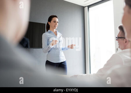 Businesswoman leading conference room meeting Stock Photo