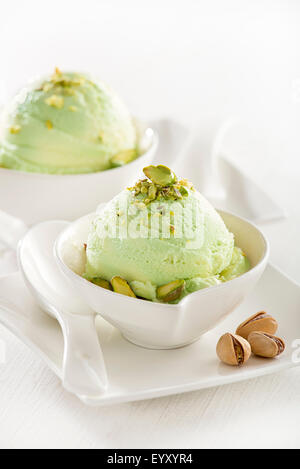 Fresh pistachio ice cream in a cup close up. Stock Photo