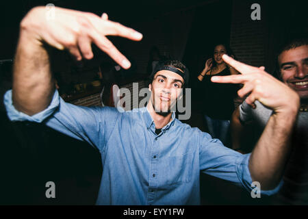 Laughing man dancing in nightclub Stock Photo