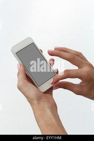 Close up of Caucasian woman using cell phone Stock Photo