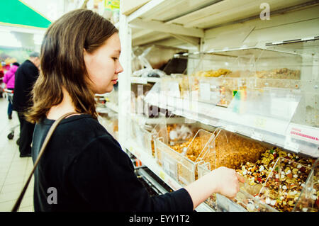 Caucasian woman shopping in grocery store Stock Photo