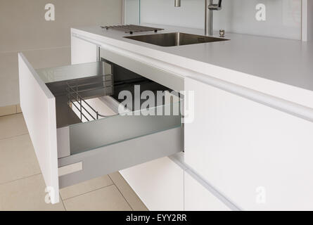 Open drawer in modern kitchen Stock Photo