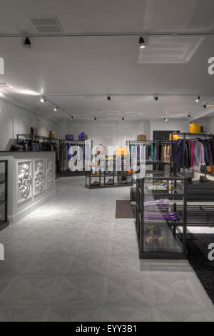 Suits and shoes in clothing store for men Stock Photo