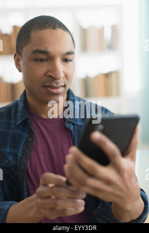 Black man using digital tablet Stock Photo