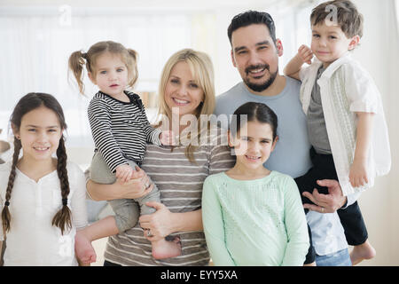 Caucasian parents and children smiling Stock Photo