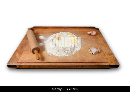 baking-board with leavened dough Stock Photo