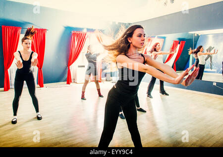 Caucasian dancers rehearsing in studio Stock Photo