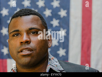 Close up of Black man in front of American flag Stock Photo