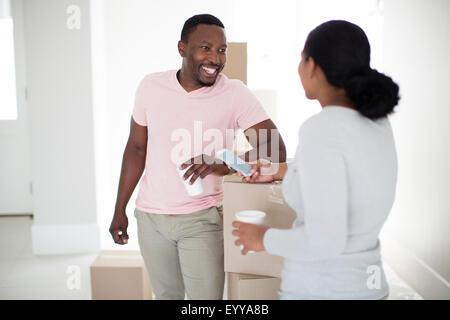 Couple with cardboard boxes in new home Stock Photo