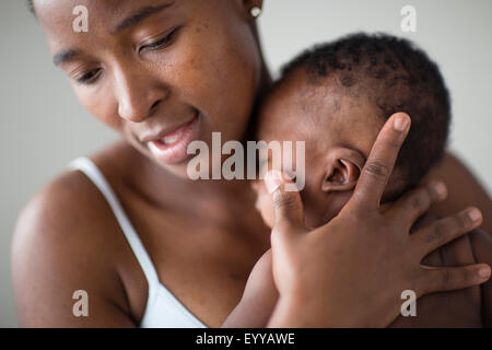 Close up of Black mother comforting baby