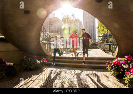 Women running in urban park Stock Photo