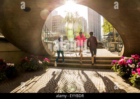 Women running in urban park Stock Photo