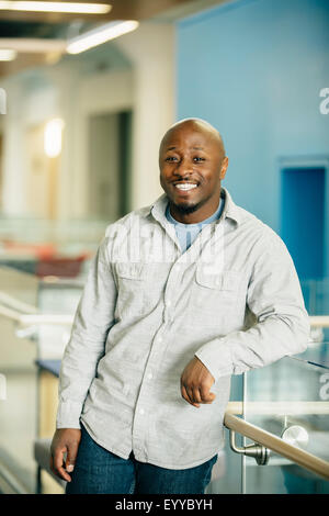 Black businessman smiling in office Stock Photo