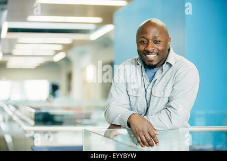 Black businessman smiling in office Stock Photo