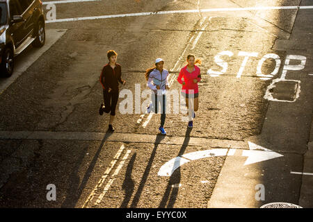 High angle view of women running in street Stock Photo