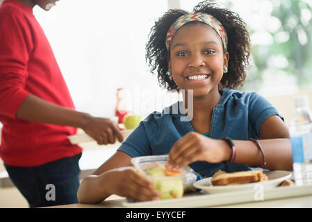 Black students eating lunch in school cafeteria Stock Photo