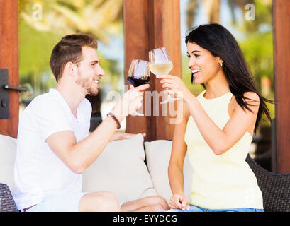 Hispanic couple toasting with wine Stock Photo
