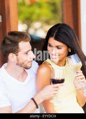 Hispanic couple drinking wine Stock Photo