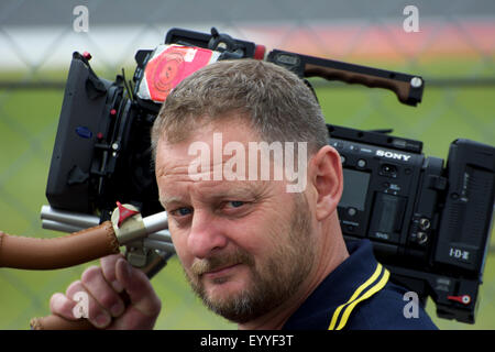 Professional sports video cameraman at Silverstone F1 GP 2015 Stock Photo