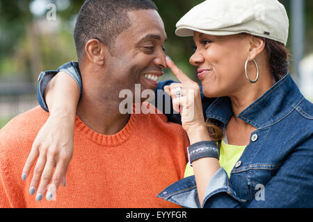 Close up of couple playing outdoors Stock Photo