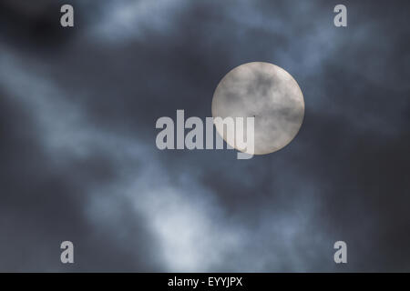 sun with sunspots behind clouds, Germany, Bavaria Stock Photo