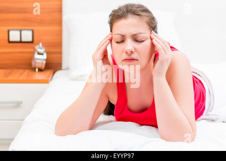 young brunette woman suffering from migraine Stock Photo