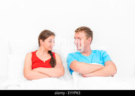 loving couple looking at each other in bed Stock Photo