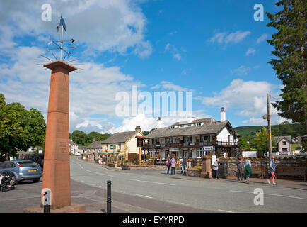 Looking along the main street Pooley Bridge village near Ullswater in summer Cumbria England UK United Kingdom GB Great Britain Stock Photo