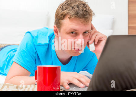man working home on the Internet remotely Stock Photo