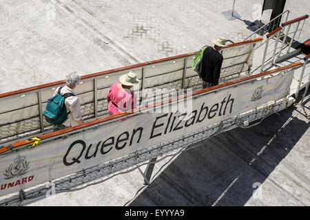 Cruise passengers departing ship  (Cunard Queen Elizabeth) for tour in Salalah. Oman Middle East Stock Photo