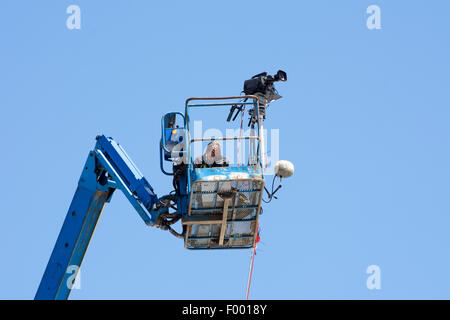 Professional sports video cameraman at Silverstone F1 GP 2015 on crane Stock Photo