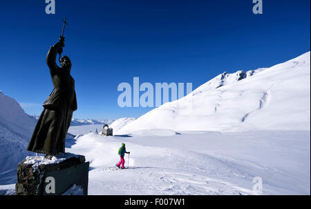 ski touring near the statue of Pierre Chanoux at Little St Bernard Pass, France, Savoie Stock Photo