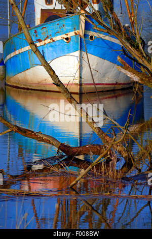 decommissioned, disused fishing cutter at a river at high tide, Germany, Bremen Stock Photo